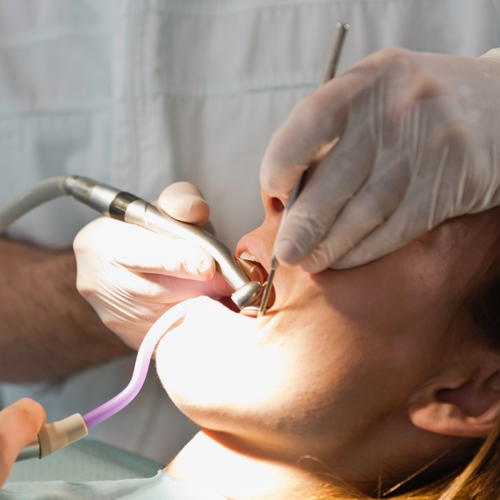 Dr Akshaysinh Vala providing dental care at Sure Cure Multispeciality Dental Clinic